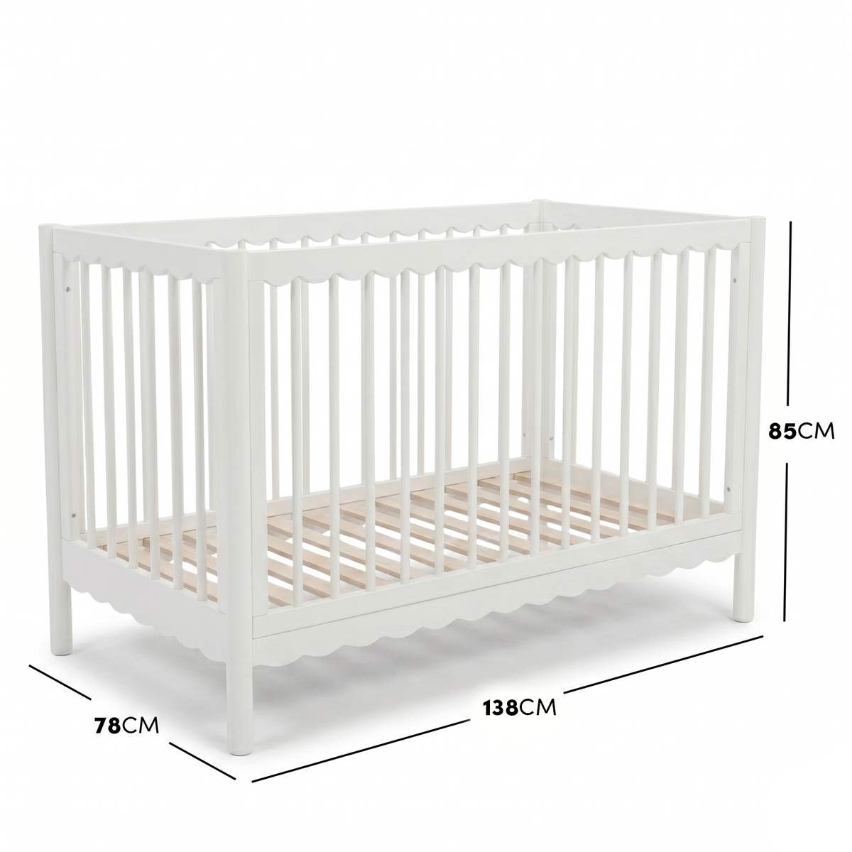 White timber baby cot with scalloped base molding and dimensions diagram.