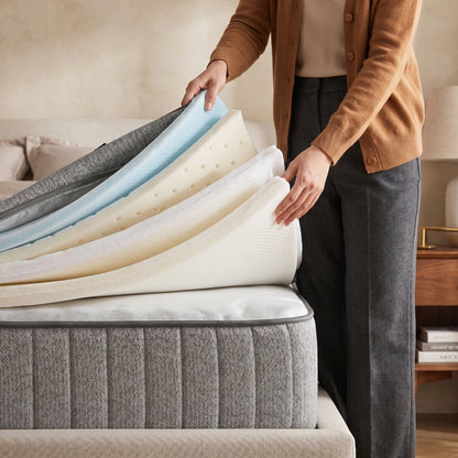 Karina adjustable firmness latex mattress with removable foam layers being lifted to show internal construction