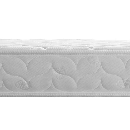 Close-up of the quilted damask-patterned Thermis Mattress atop the Momo Solid Pine Loft Bed, featuring a visible “Luxo Bedding” tag. The black foundation supports the mattress elegantly.