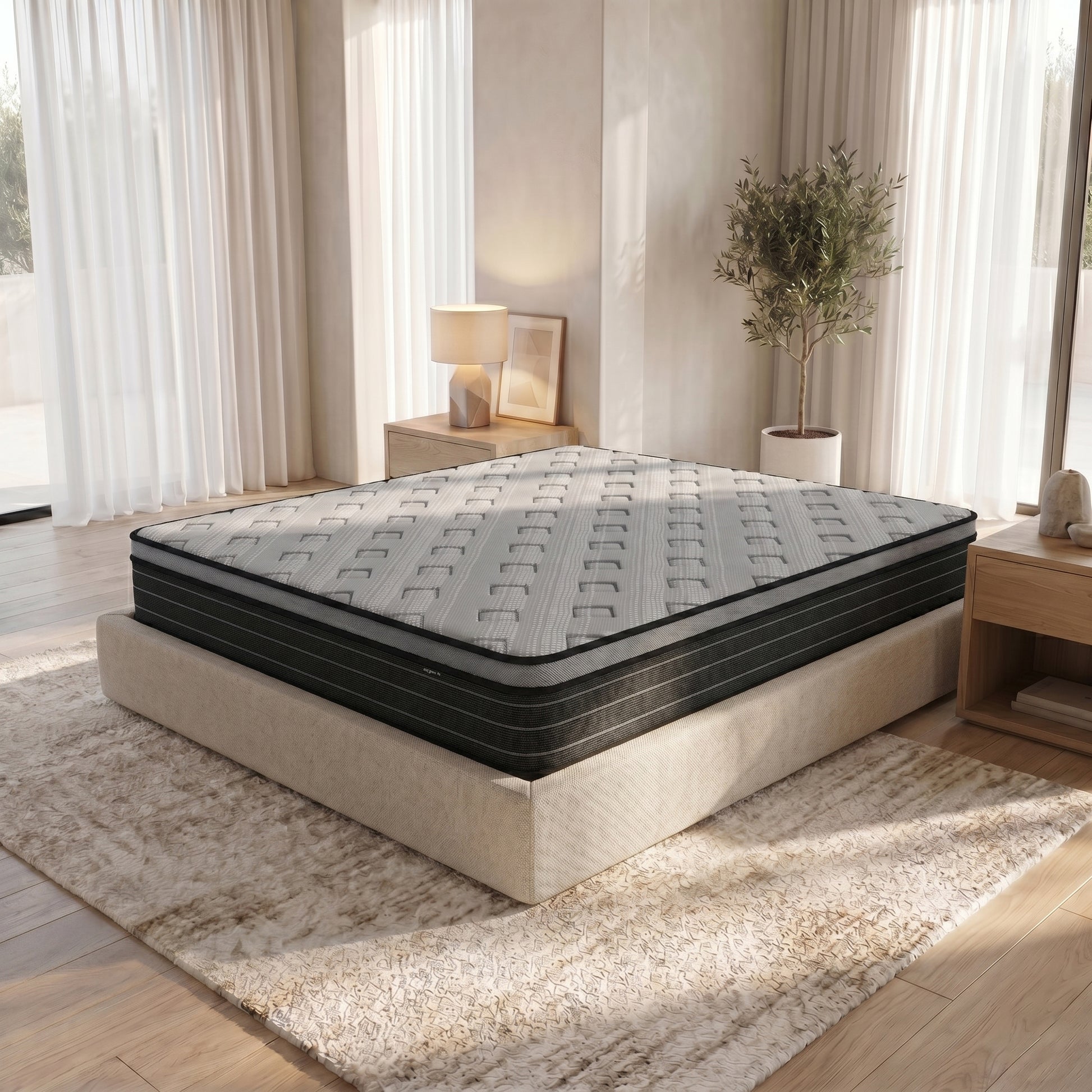 Phoebe King 33cm Euro Pillow Top Pocket Spring Mattress with grey quilted top and black side panels on a beige upholstered