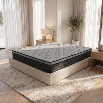 Phoebe King 33cm Euro Pillow Top Pocket Spring Mattress with grey quilted top and black side panels on a beige upholstered