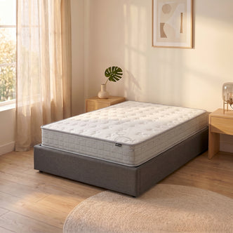 Thetis Double 25cm Pocket Spring Latex Mattress in Med Firm with quilted white top and grey sides on upholstered grey base