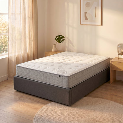 Thetis King 25cm Pocket Spring Latex Mattress in Med Firm with white quilted top and grey side panels on a charcoal
