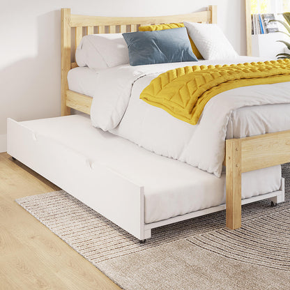 Narell Single Solid Wood Pull-Out Trundle Bed in White with a light-wood frame, white sheets, mustard-yellow throw, slate-blue cushion, and visible white trundle on caster wheels beneath.