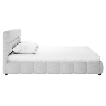 Nikias Queen Bouclé Fabric Bed Frame in Light Grey features a side view of a tufted headboard, padded frame, and pillows, showcasing its elegant, textured bouclé upholstery for a modern bedroom appeal.