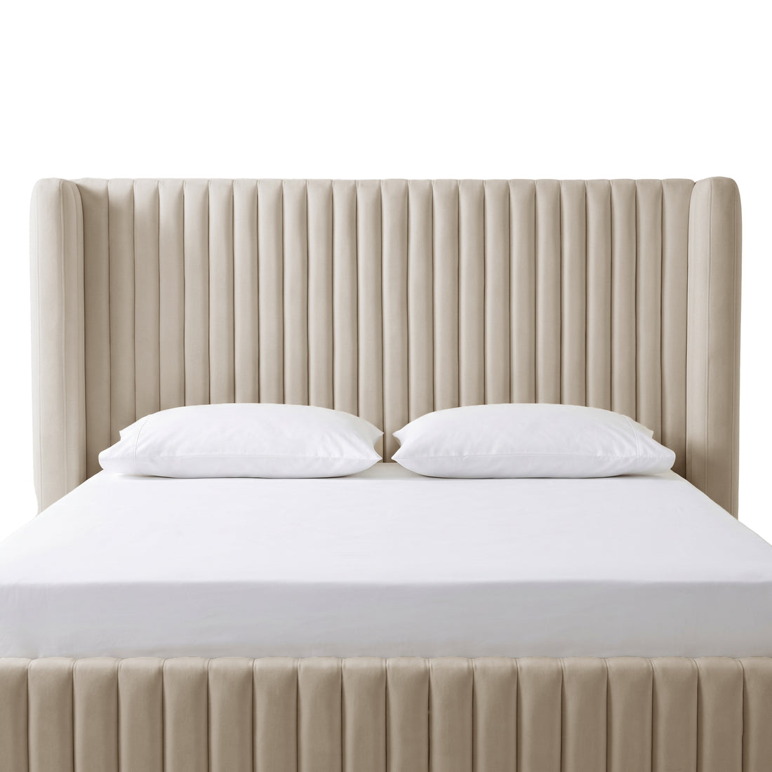 Warm grey velvet king bed frame with vertical channel tufting, white fitted sheet and two white pillows, white background