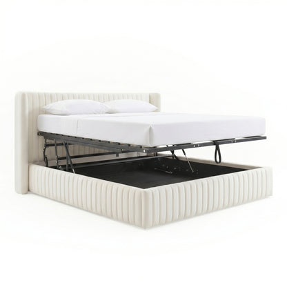 Cream white velvet upholstered queen bed frame with gas lift mechanism revealing open under-bed storage, shown with mattress