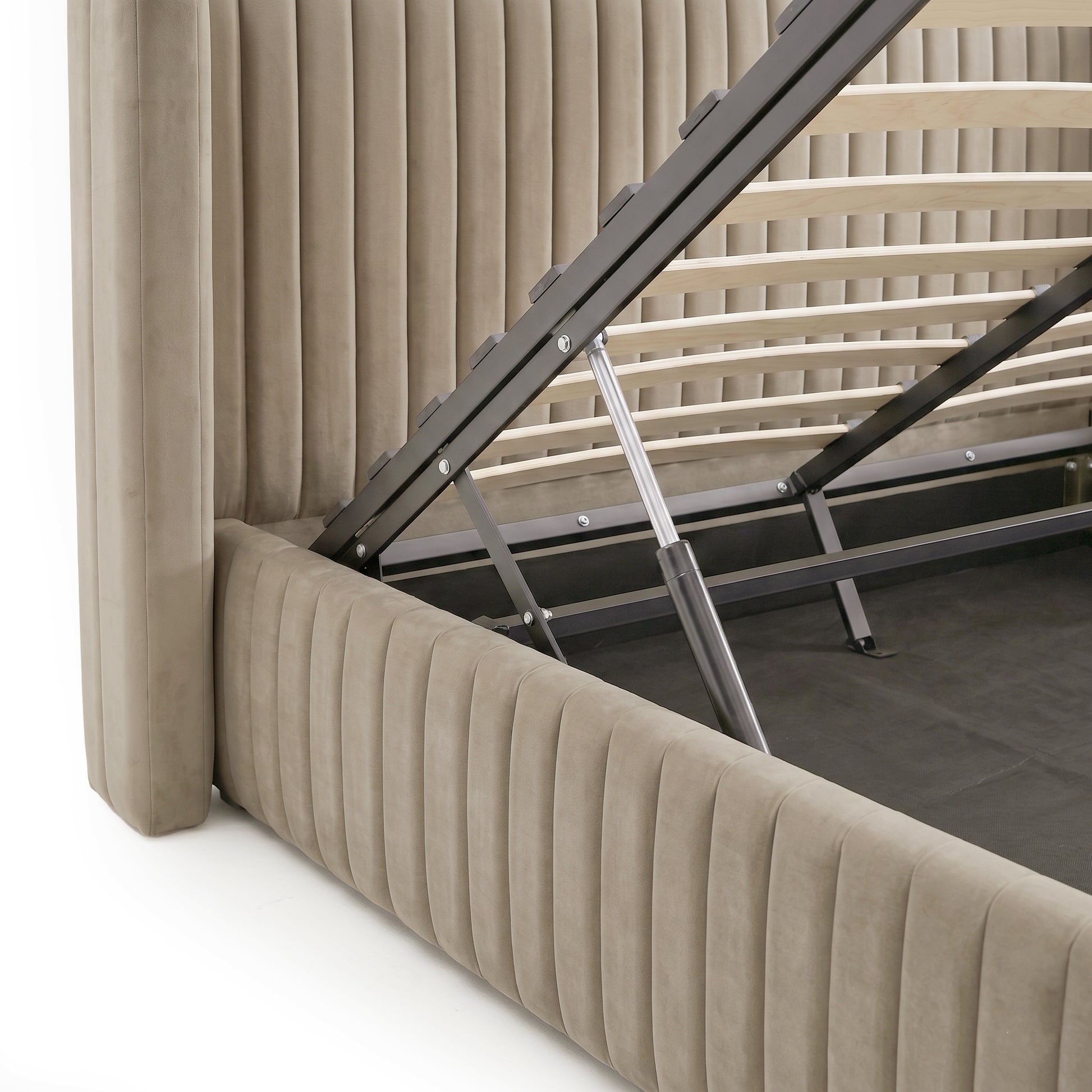 Warm grey velvet queen bed frame with vertical channel tufting, gas lift storage base and wooden slats
