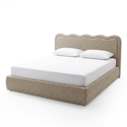Beige boucle upholstered king bed frame with scalloped headboard, gas lift storage base, white mattress and two white pillows