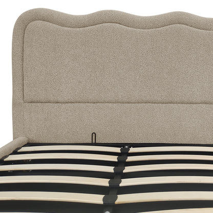 Close-up of beige boucle upholstered headboard and gas lift storage bed frame slats
