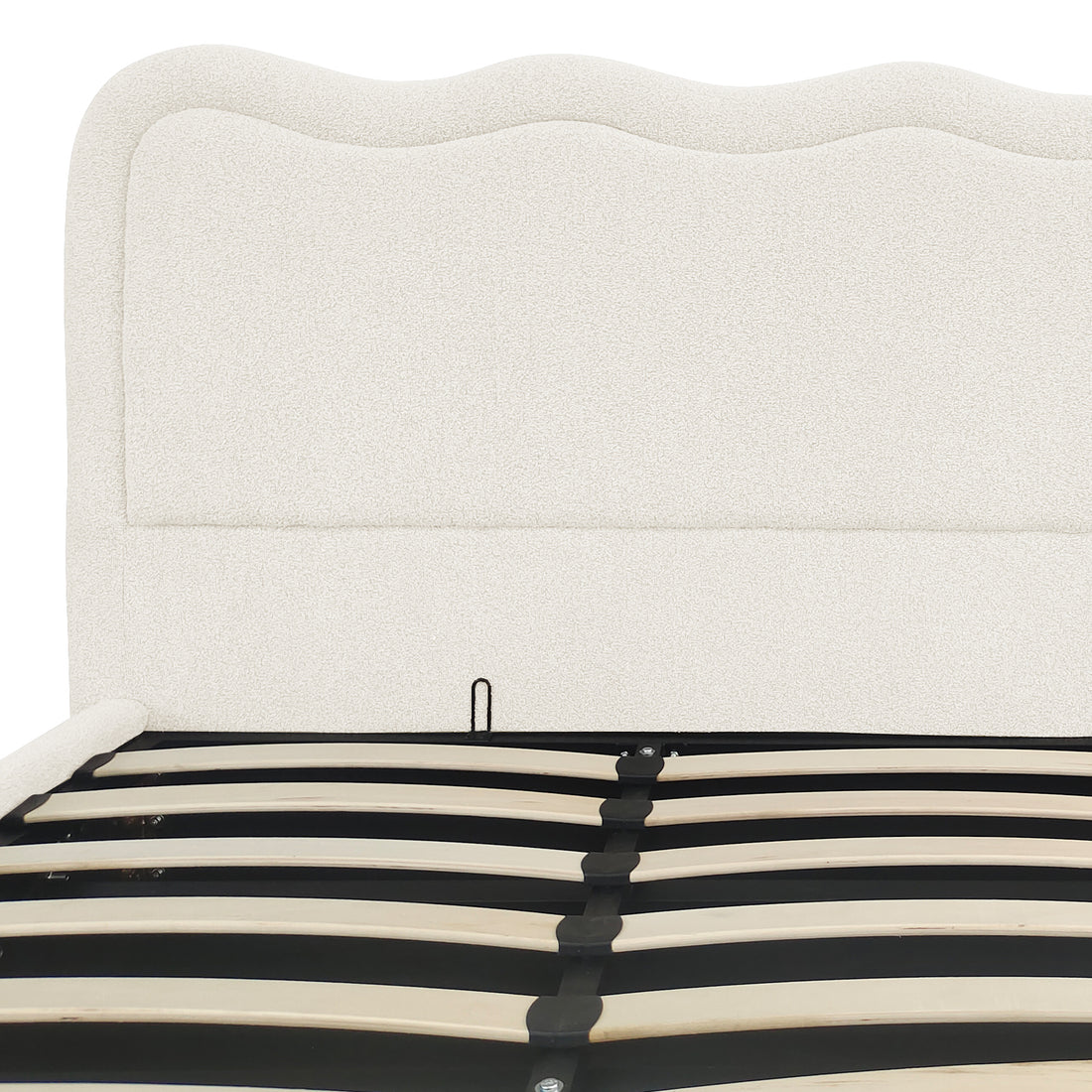 Cream white boucle upholstered bed with curved headboard and gas lift storage slats