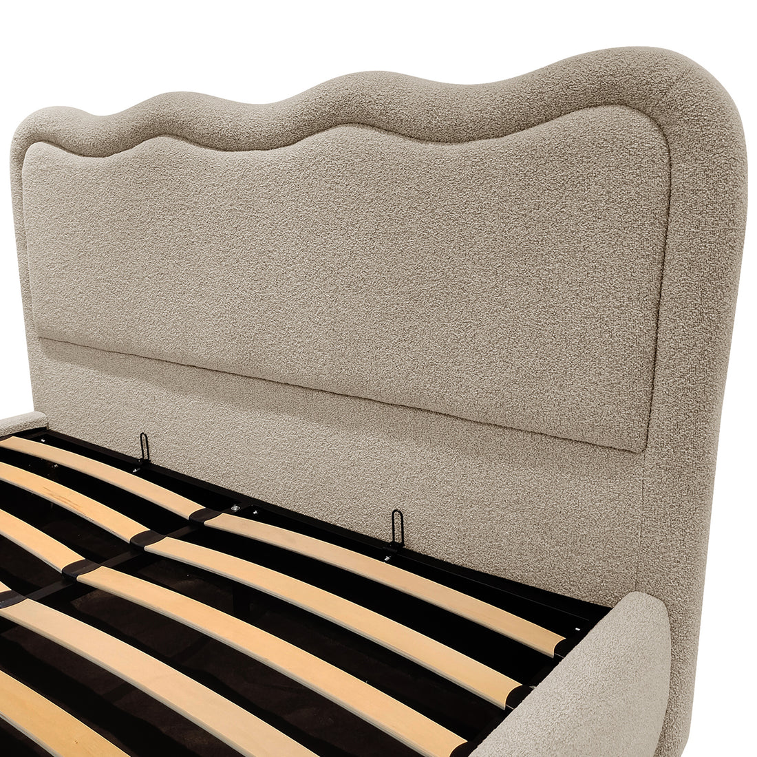 Close-up of Noemi Queen Boucle Gas Lift Storage Bed beige upholstered headboard with scalloped top edge and wooden slat base