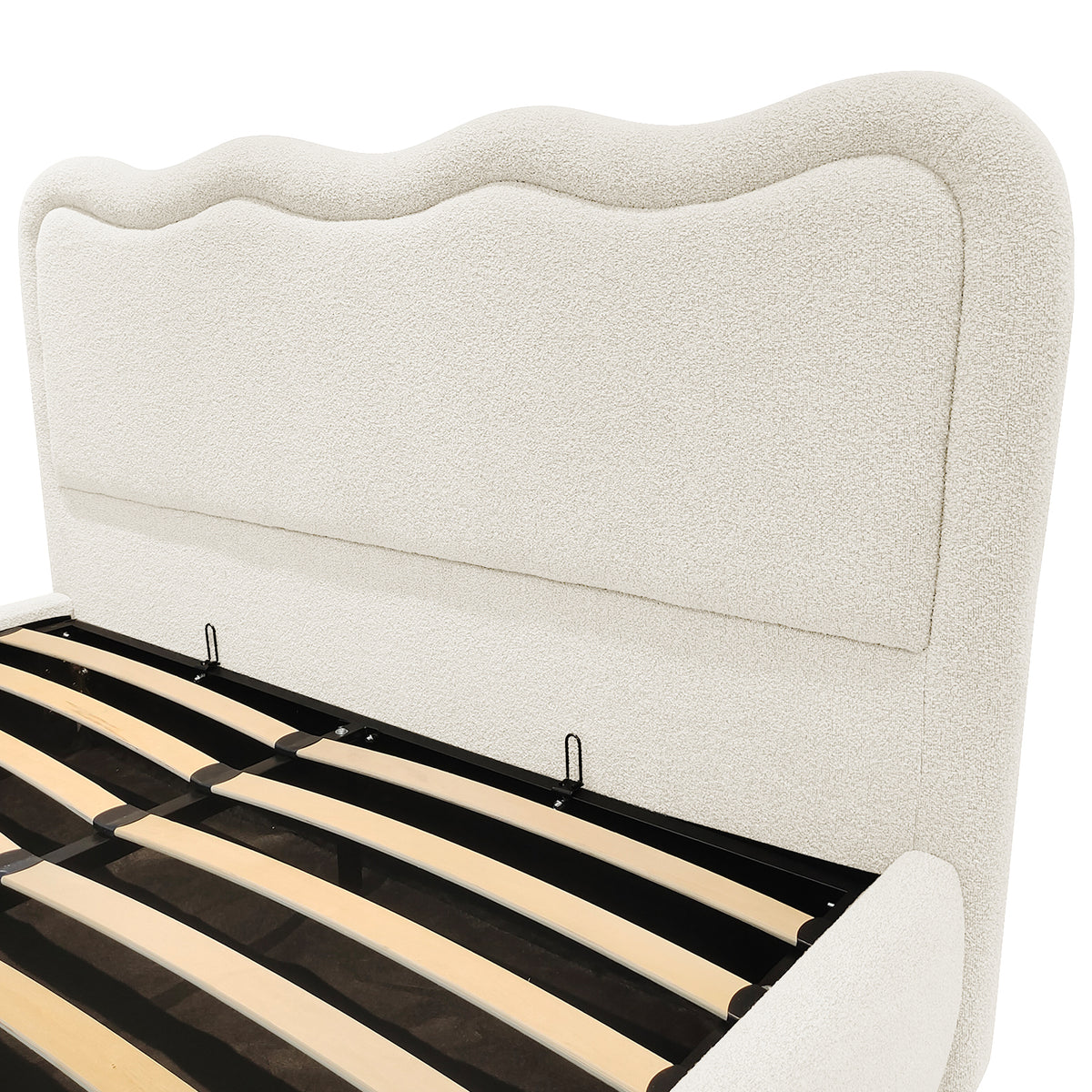 Cream boucle upholstered bedhead with curved top and gas lift storage base showing wooden slats