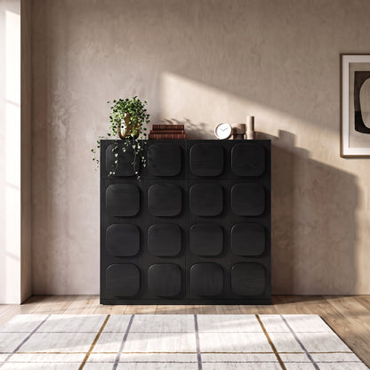 Black cabinet styled in a living room setting with decor
