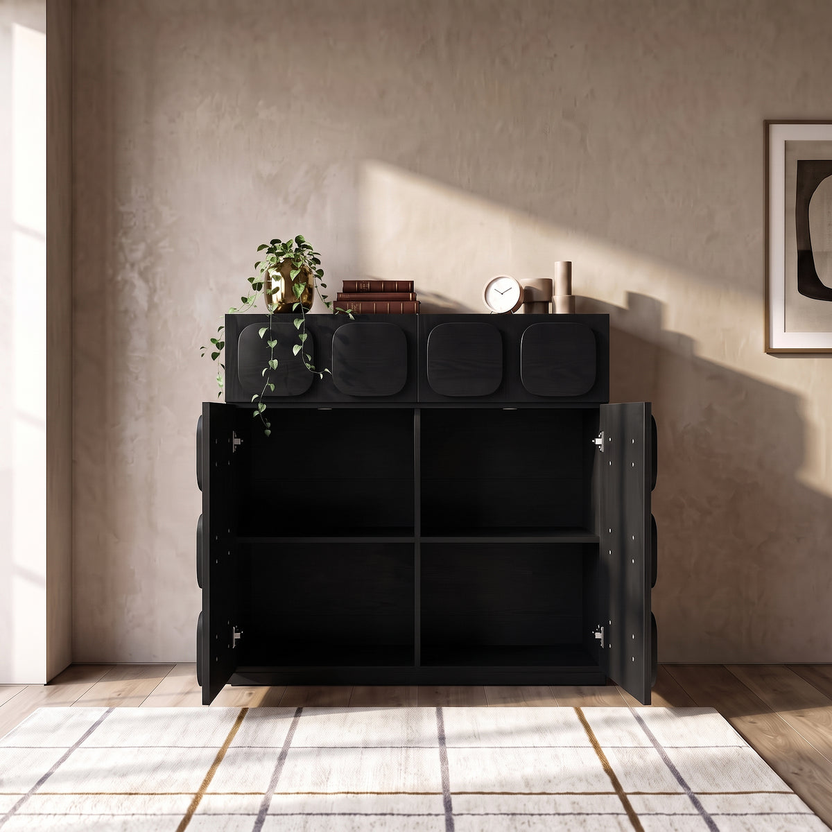 Black cabinet styled in a living room setting with decor