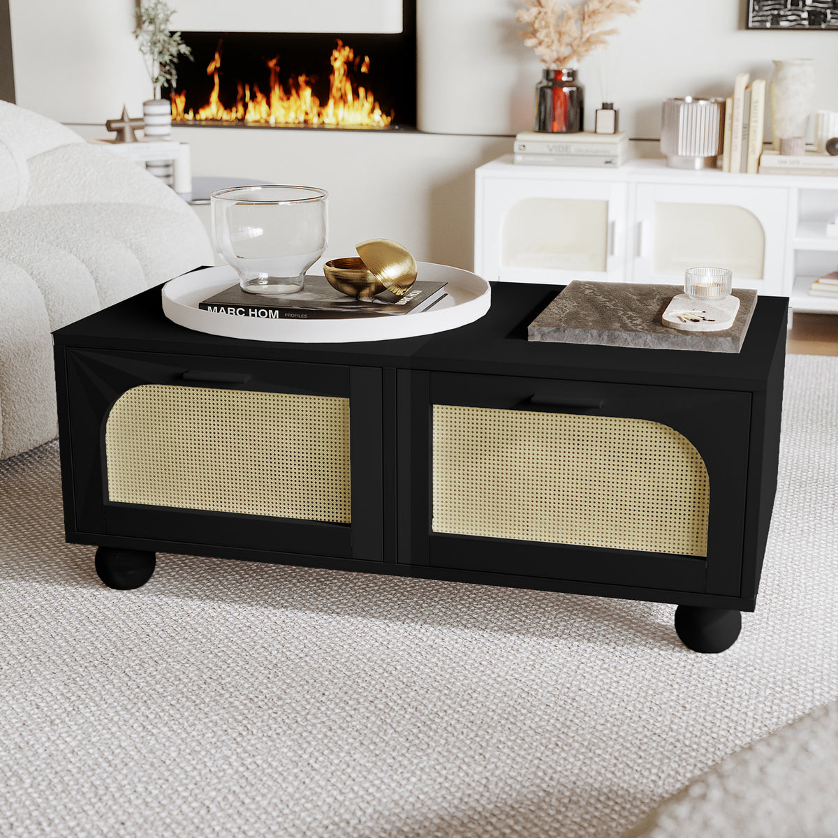 Carlo 110cm Rattan Coffee Table with Storage in Black features gold-tone woven cane panels, a sleek surface adorned with decorative items, and blends seamlessly into a modern living room setup.