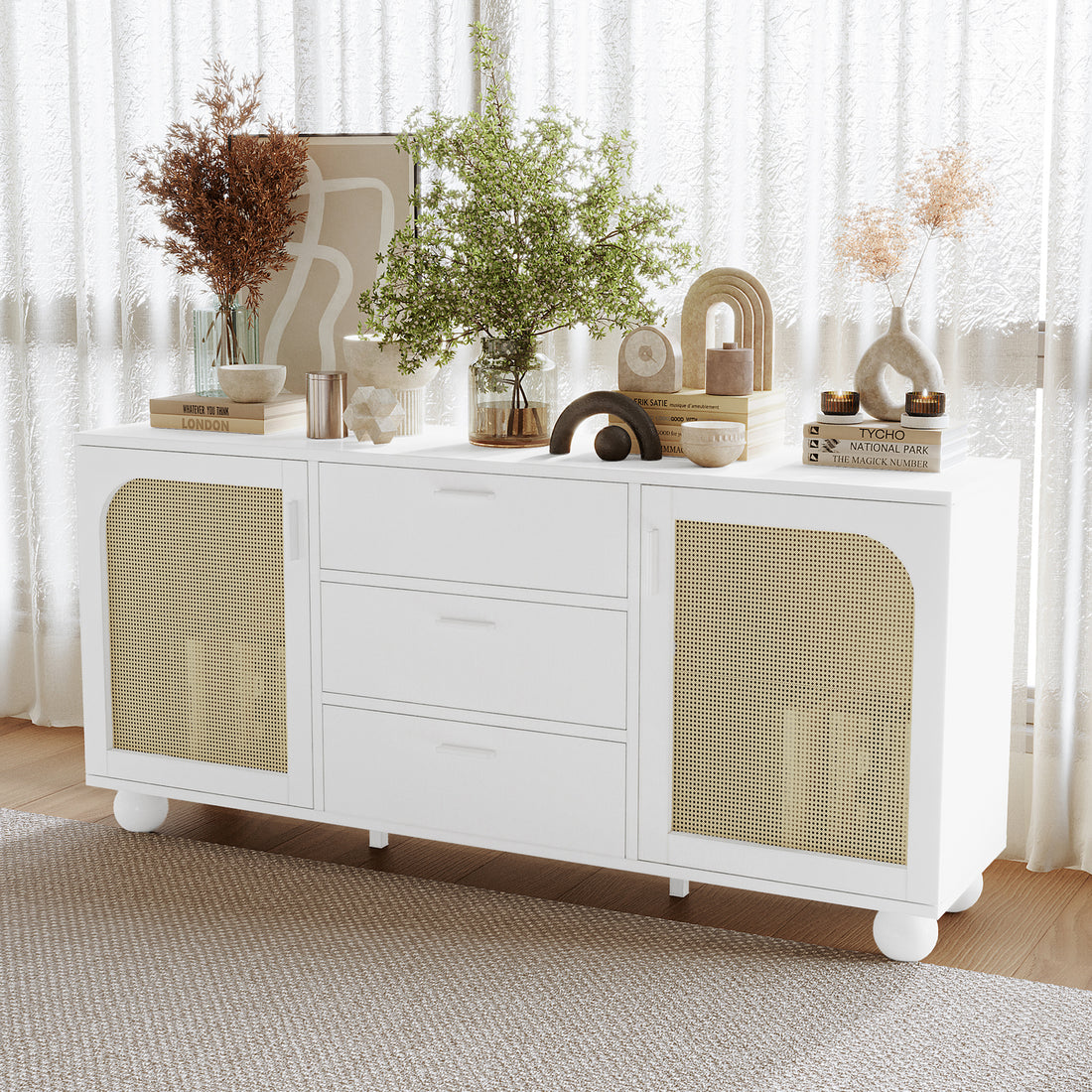 White Carlo 160cm sideboard with rattan doors, three drawers, and rounded feet