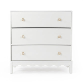 White three-drawer dresser with gold flower knobs on white background
