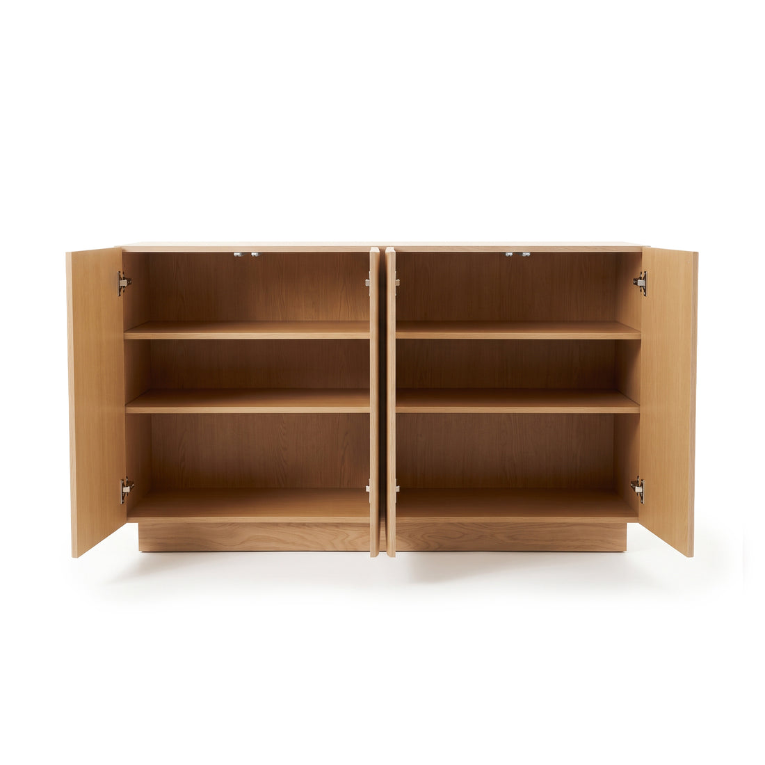 Oak sideboard with all four doors open, revealing multiple interior shelving tiers and concealed hinges against a plain white studio background