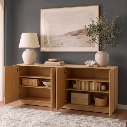 Oak sideboard with open fluted doors revealing styled interior shelves, books, and storage baskets against a dark grey accent wall.