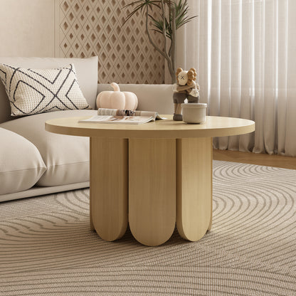 Hugo 70cm round coffee table in natural wood finish with three curved pedestal legs