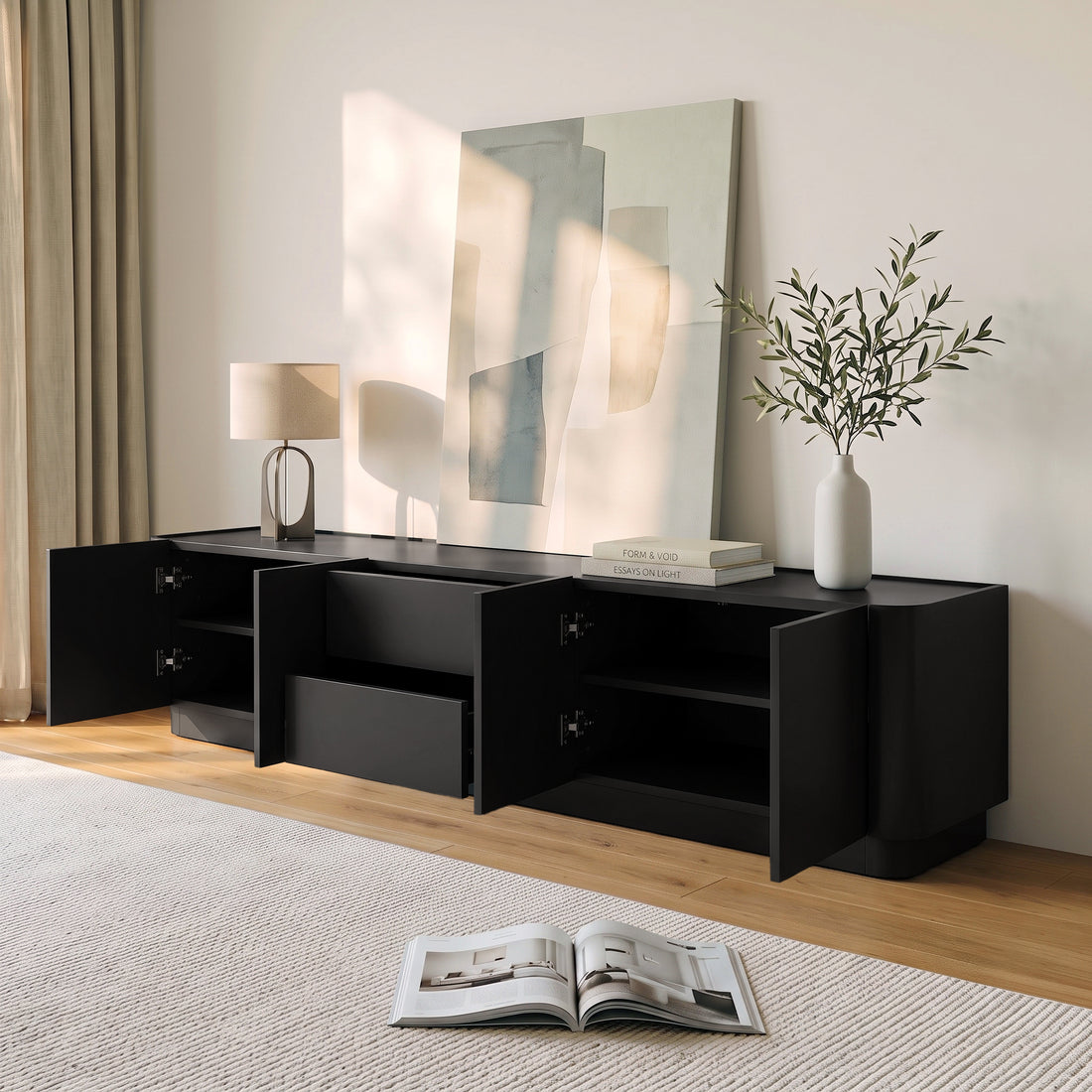 Black TV stand styled in a modern living room