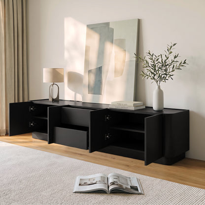 Black TV stand styled in a modern living room