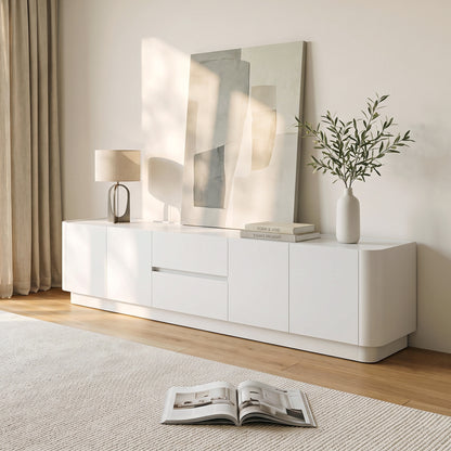White modern sideboard styled in a bright living room