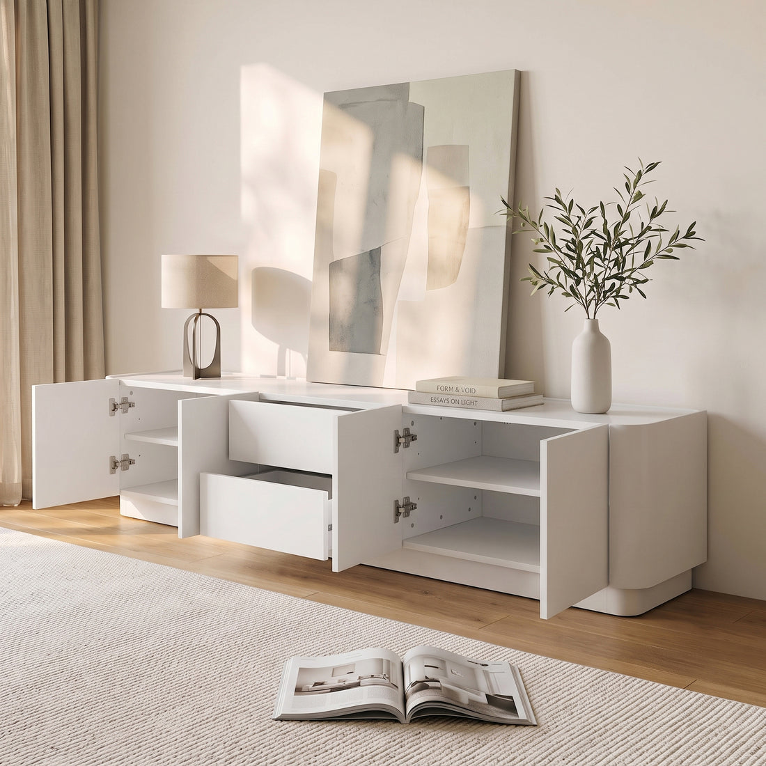 White sideboard styled in a modern living room with decor