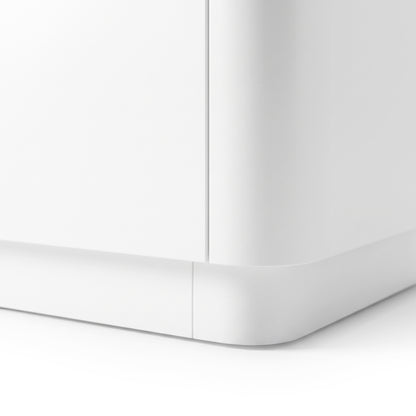 Close-up of the bottom corner of a white furniture piece