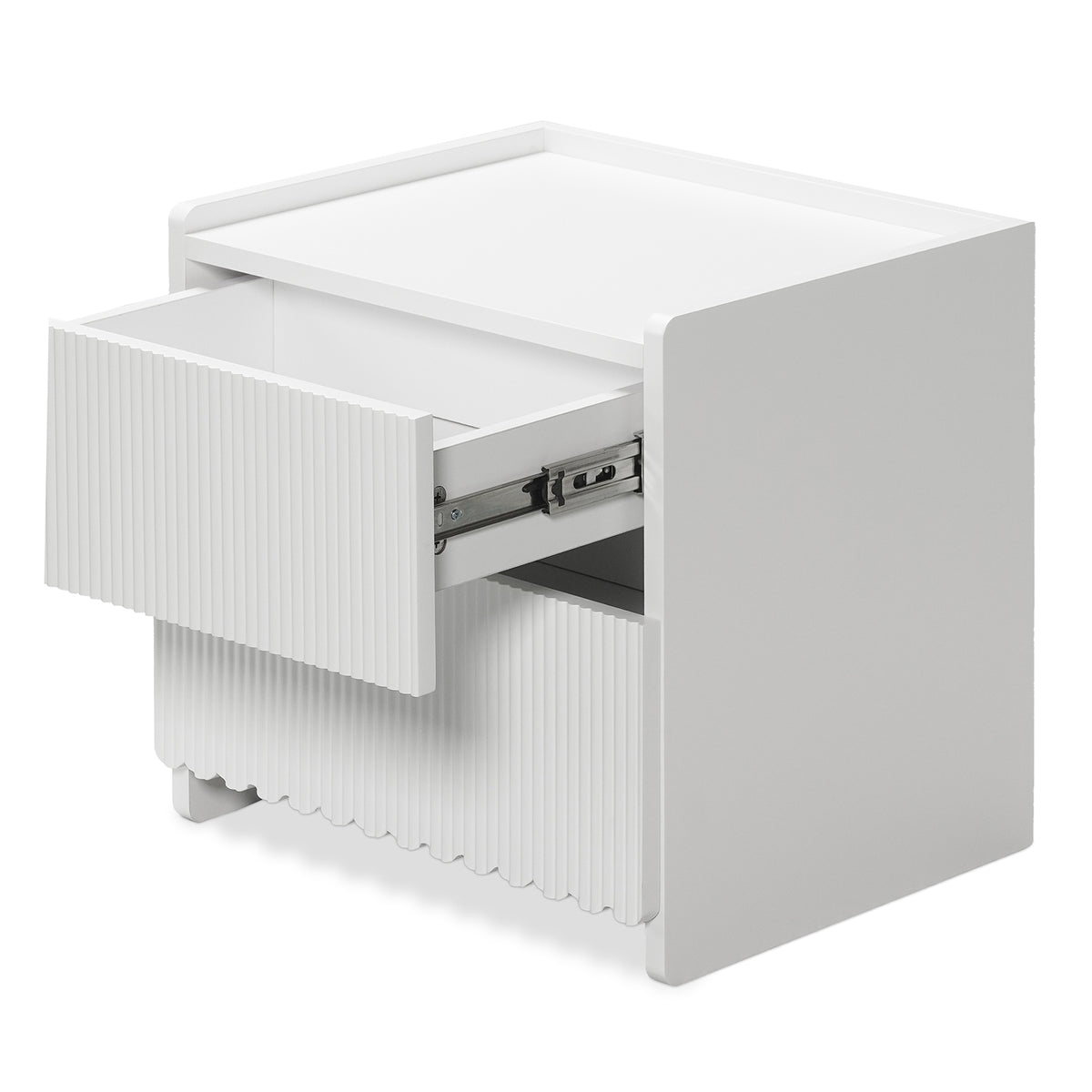 Nasrin 2 Drawer Bedside Table in White features a minimalist design with vertically fluted drawer fronts, short block-style legs, and a partially open top drawer revealing metal slides.