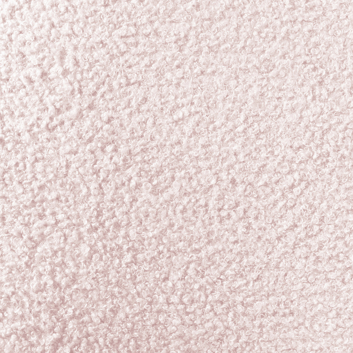 Tyla Boucle Upholstered Bedside Table features a close-up of light pink boucle fabric, showcasing its plush, nubby texture with tightly packed looped fibers, highlighting its soft sophistication and modern elegance.