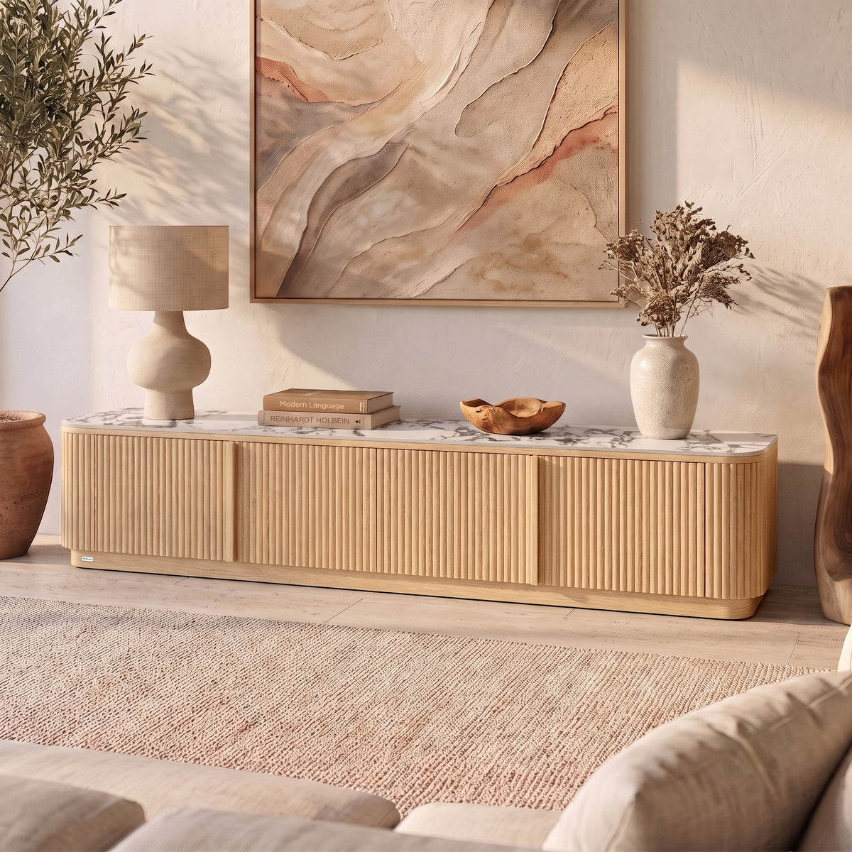 Natural wood TV unit with ribbed doors, marble-look top, rounded edges in styled living room