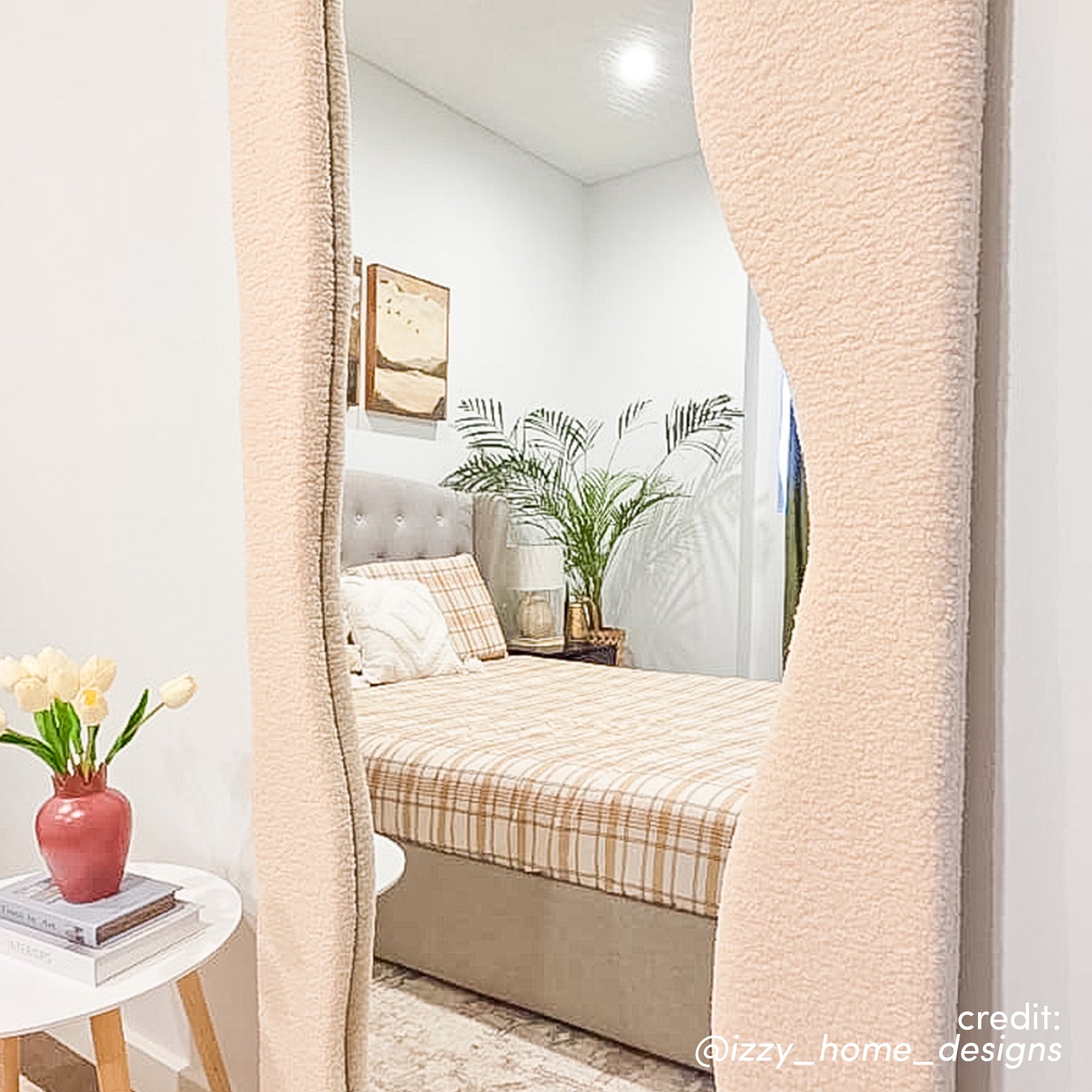Sabrina 180cm Curved Full Length Mirror in Beige with textured wavy frame reflecting bedroom