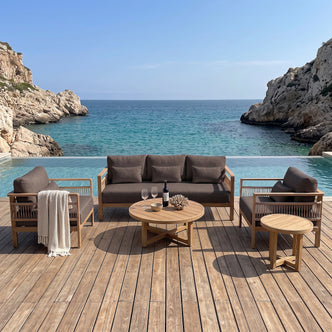 Outdoor furniture set arranged on a deck overlooking the ocean