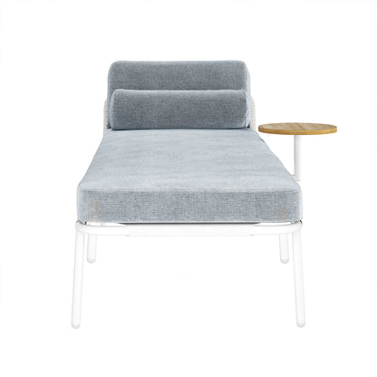 Andre Wicker Outdoor Sun Lounger with Cushion in Light Grey featuring a light-grey cushion, cylindrical bolster pillow, white metal frame with slim legs, and an integrated small round wooden side table.
