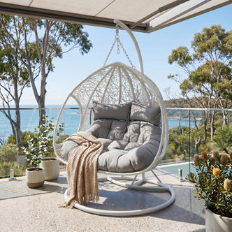 Basin 2-Seater Hanging Egg Chair with Cushion in White, featuring a woven open-lace design, curved metal stand, grey tufted