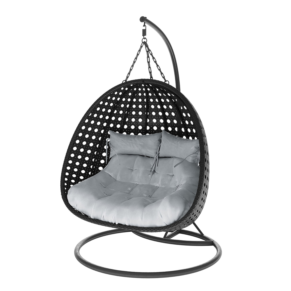 Buena 2 Person Wicker Outdoor Hanging Egg Chair in Black, features a freestanding rattan shell suspended by chains, with a round metal base and curved arm, housing thick tufted cushions for comfort.