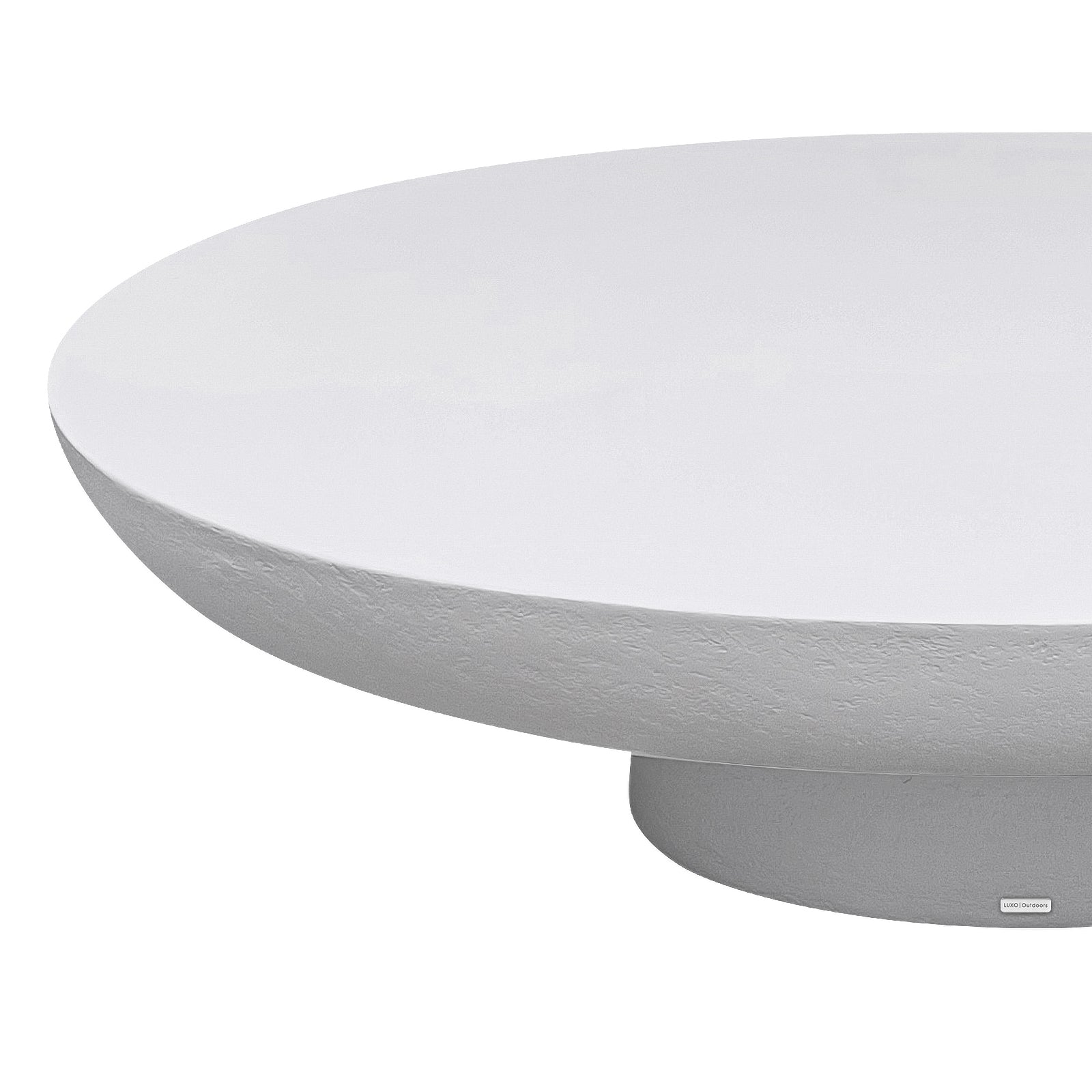 Cassius Oval Outdoor Concrete Coffee Table in White, close-up detail of smooth oval top and textured sculptural base