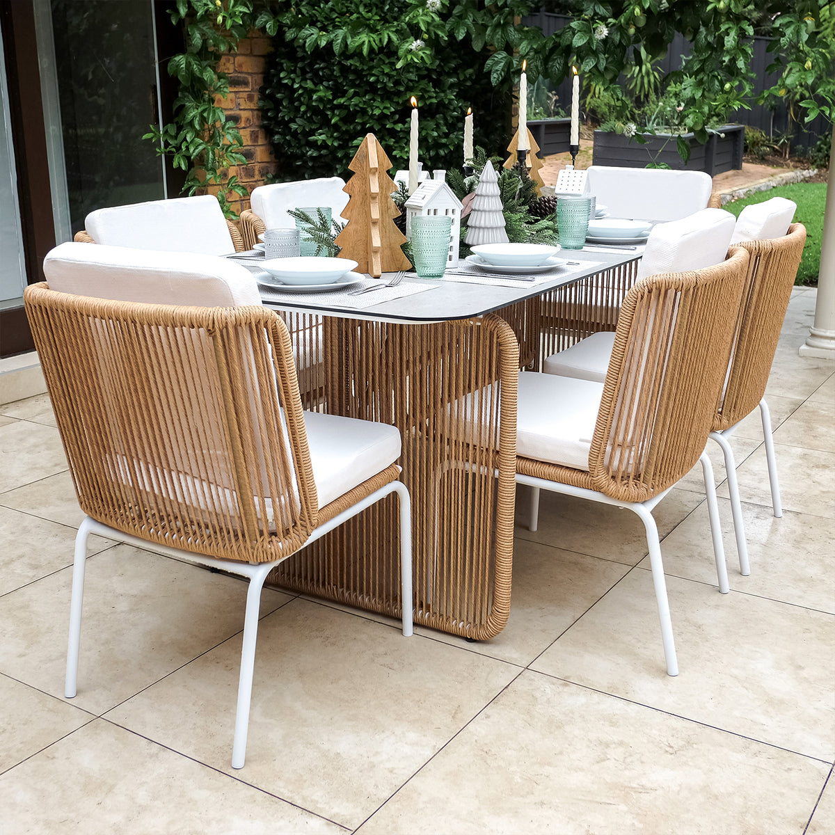 Craigie Premium 6-Seater Outdoor Dining Set features a ceramic glass table and six chairs. The table's elegant design and sturdy chairs make it ideal for outdoor dining spaces.