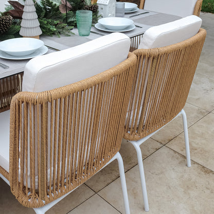 Craigie Premium 6-Seater Outdoor Dining Set features a sleek ceramic glass table with a marble-like pattern and sturdy wicker chairs, ideal for stylish and durable outdoor dining.