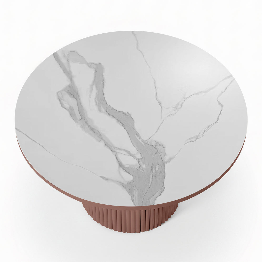 Top-down view of a round white stone dining table with grey marble-effect veining and a terracotta-colored fluted pedestal base.