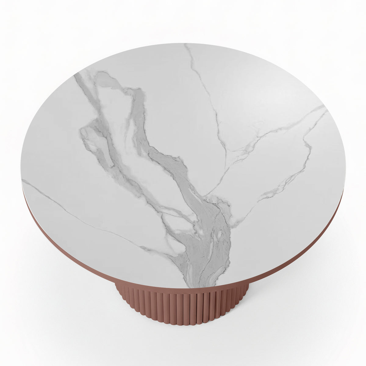 Top-down view of a round white stone dining table with grey marble-effect veining and a terracotta-colored fluted pedestal base.