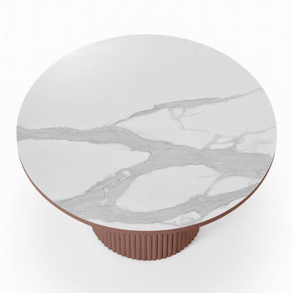 Top-down view of a round white stone dining table with grey marble-effect veining and a terracotta-colored fluted pedestal base_2
