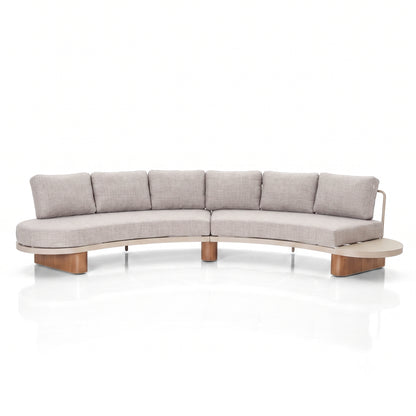 Modern curved sectional sofa with light gray upholstery and wooden base on a white background.