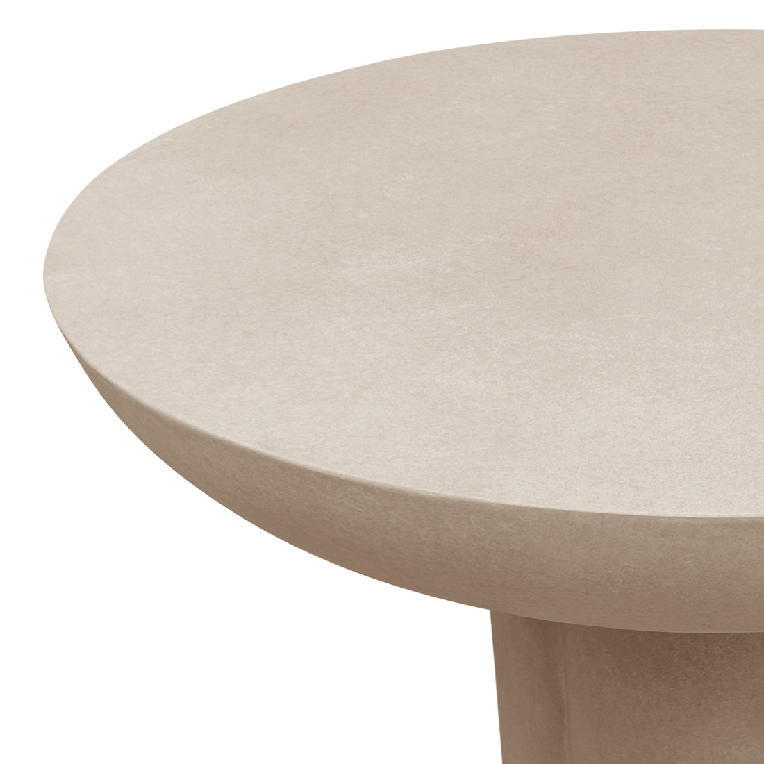 Close-up of the curved edge of the Jareth 80cm round concrete outdoor entry table in ivory