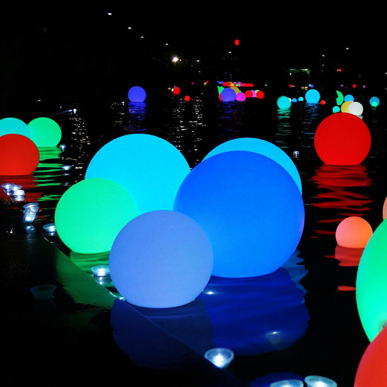 Waterproof Outdoor LED Ball Lights Décor 60cm floating on water, showcasing a sleek round design. Ideal for enhancing outdoor spaces with vibrant lighting, perfect for events, pools, and gardens.