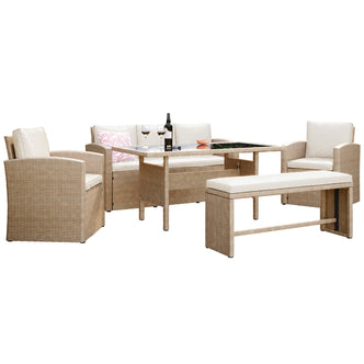 Mapa 7 Seater Wicker Outdoor Sofa Dining Set featuring a close-up of a wicker chair, a white pillow, and a bench, highlighting its elegant design and spacious seating arrangement.