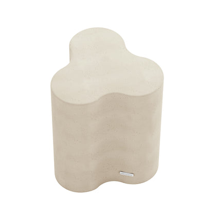 Top-down angled shot of Antique White Odalys concrete side table, highlighting its distinctive wavy shape
