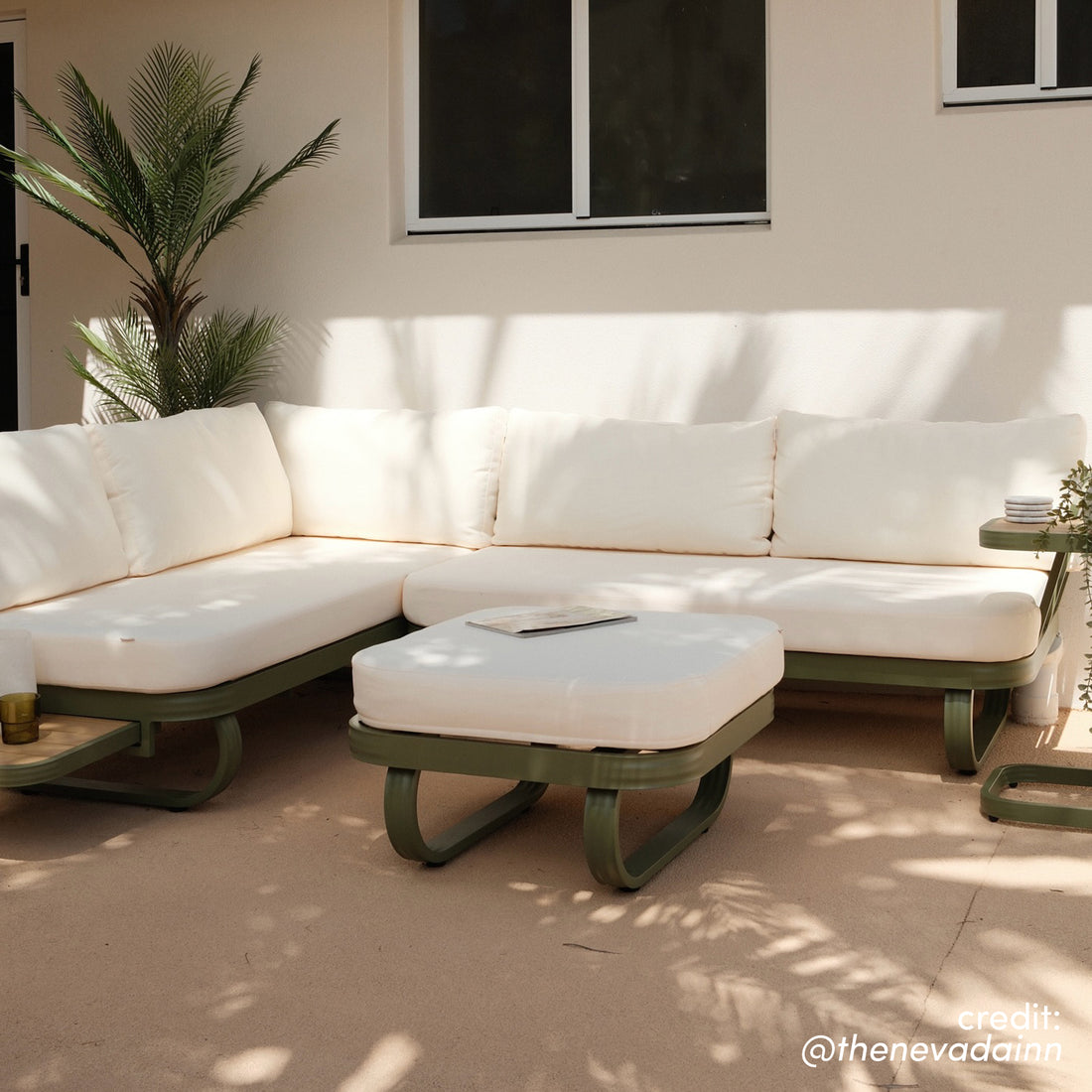 Paloma Modular Outdoor Lounge Set in Olive Green with L-shaped sectional, cream cushions, matching ottoman, and side tables